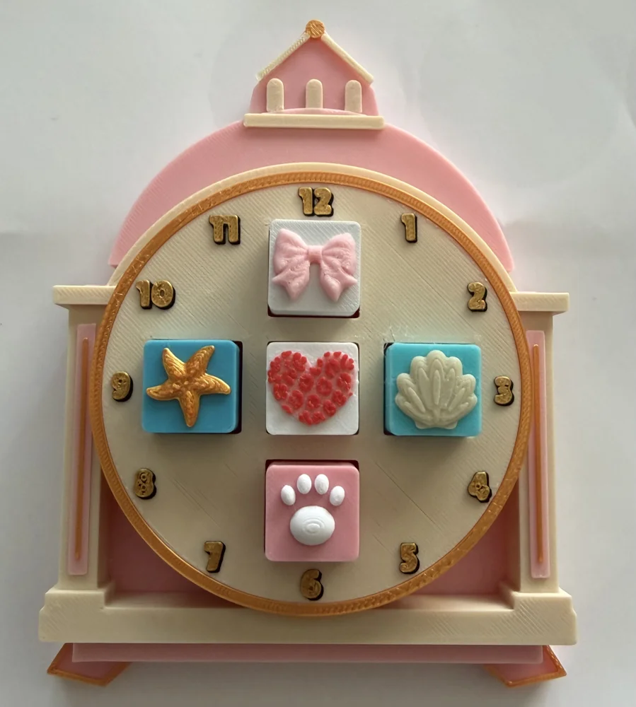 Pink and cream Castle Clock Clicker with gold numbers and five decorative clicker keys