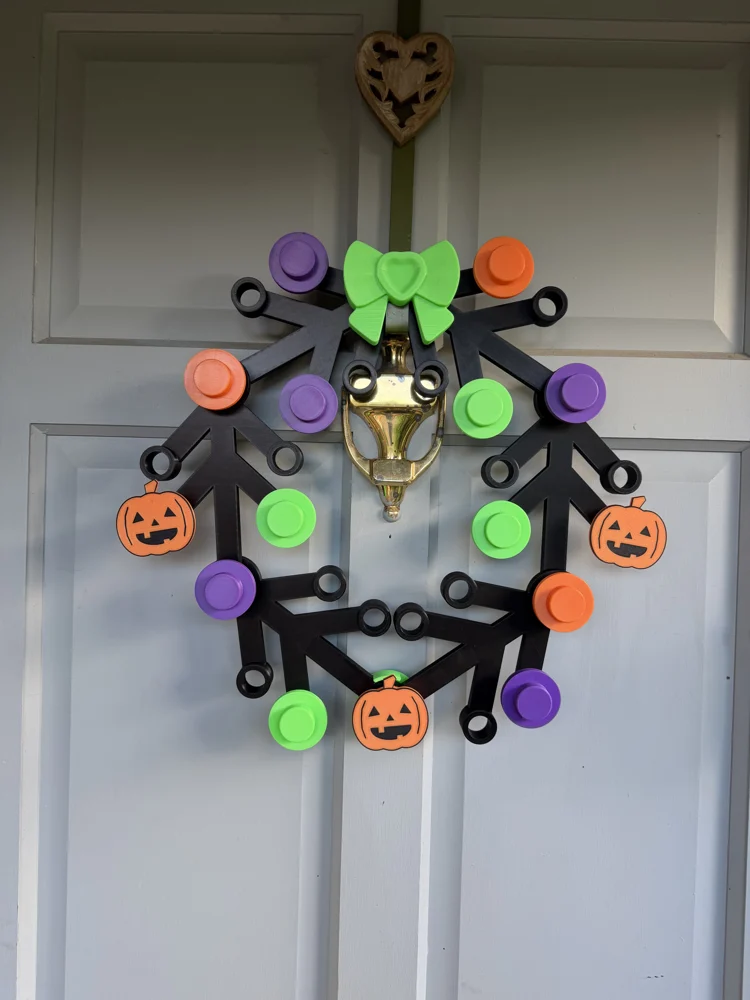 Classic Halloween wreath with pumpkin buttons, orange, purple and green buttons and a green bow